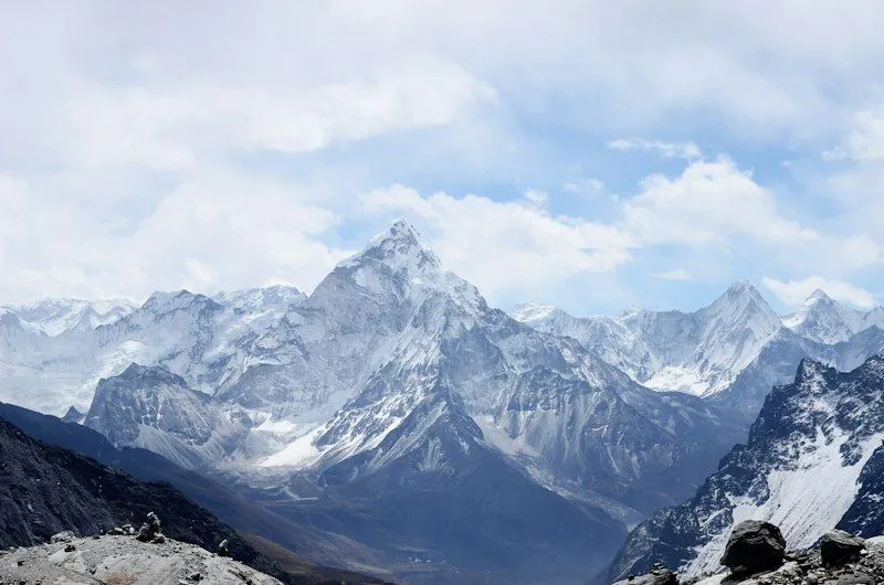 A snow-covered peak above a ridge line